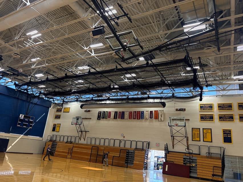 Batting cage replacement, side view during Gymnasium Equipment Installation at Buckingham Browne & Nichols School.