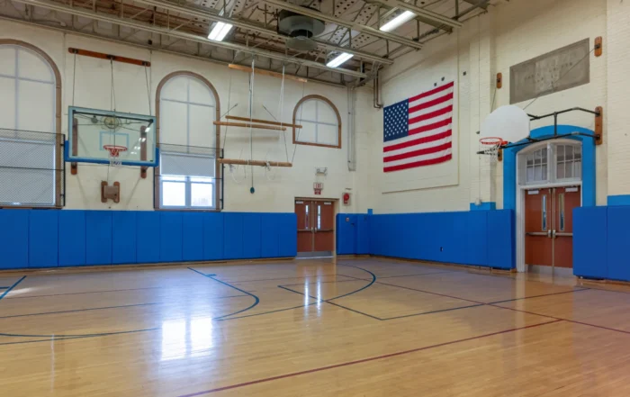 Wall pads for basketball court enhancing player safety and protection