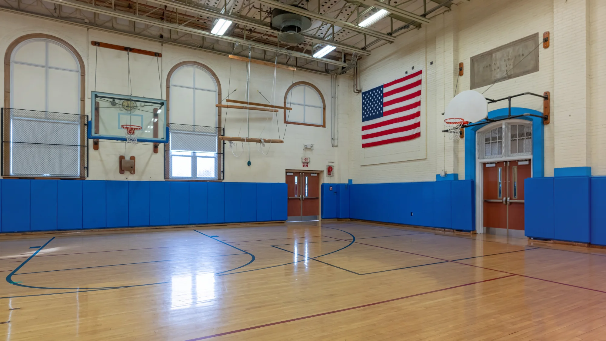 Wall pads for basketball court enhancing player safety and protection